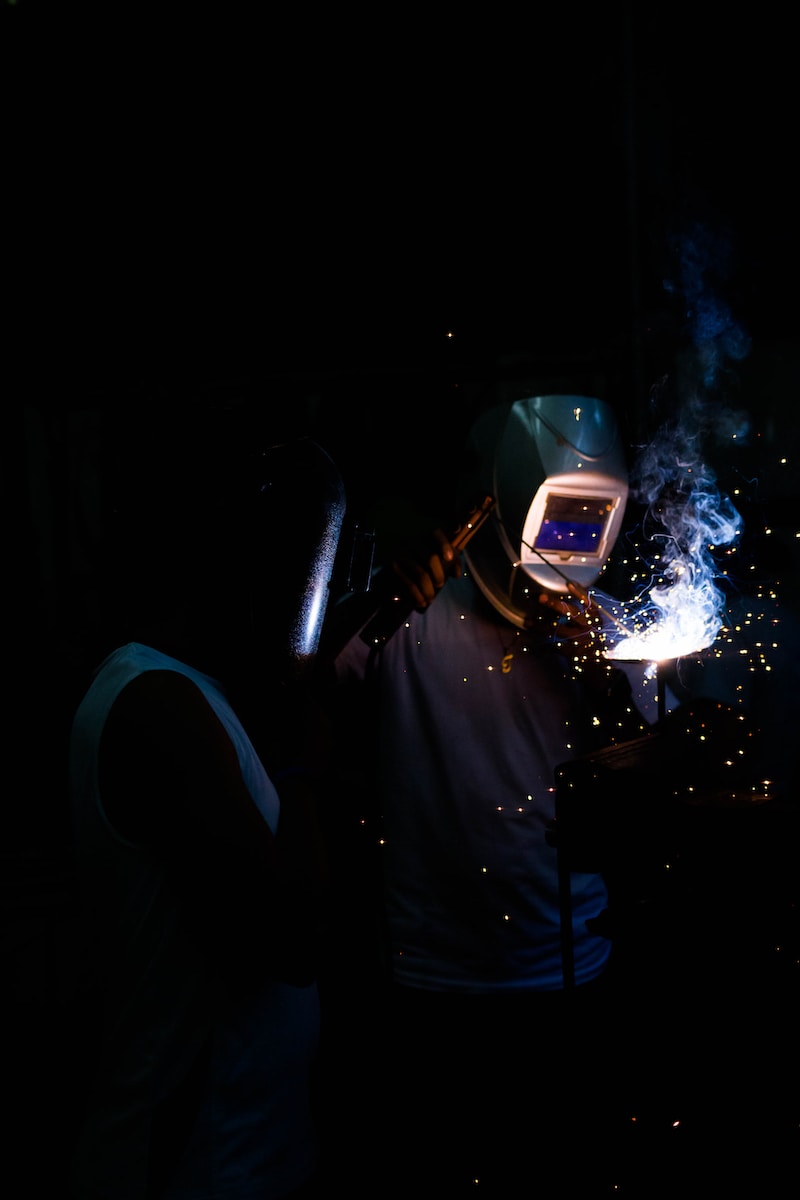 man welding and wearing mask